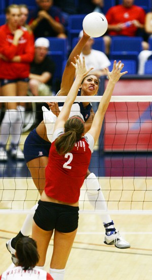 Arizona outside hitter Whitney Dosty smacks the ball over the net during the Wildcats 3-0 win against Washington State in the McKale Center Friday night. Arizona lost 3-2 to No. 9 Washington the following night putting the Wildcats record at 11-2, 1-1 in the Pac-10.