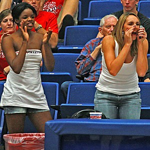 Former Arizona volleyball players Jennifer Abernathy, left, and Bre Ladd cheer on the Wildcats during Arizonas four-set loss to then-No. 3 UCLA Friday in McKale Center. Both players, who used up their eligibility last season, help out the young UA squad by simulating top opponents in practice.