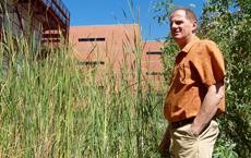 Ron Stoltz, Director of the College of Architecture and Landscape Architecture stands in the Underwood Family Sonoran Landscape Lab, which landscape architecture students are using as a study of water conservation.