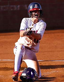 Arizonas Autumn Champion celebrates as she slides across home for Arizonas first run in their 5-0 win over LSU, Friday, May 26, 2006 at Hillenbrand Stadium.