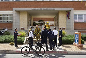 UA police and fire personnel discuss safety concerns after an overheated motor was found to be the source of smoke in the Family and Consumer Sciences building around 11 a.m. yesterday. Students and teachers were evacuated from the building for about an hour.