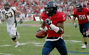 Cornerback Antoine Cason returns the game-winning interception for a touchdown in Arizona's 24-20 win over then-No. 8 California on Nov. 11 at Arizona Stadium. Cason announced yesterday that he will return for his senior year.