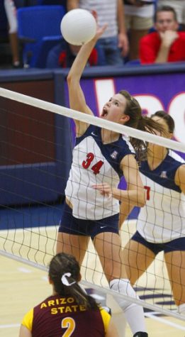 UA setter Paige Weber swats the ball in Wednesday night's 3-0 win against ASU in McKale Center. The Wildcats improved to 12-2 on the season, as they beat the Sun Devils for the first time since 2005.