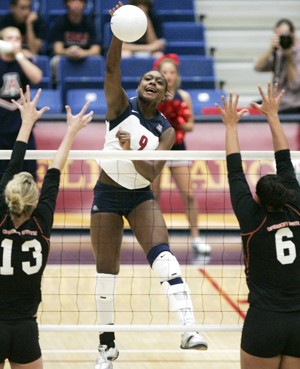 Arizona outside hitter Tiffany Owens swats the ball during a 3-0 win over Oregon State on Sunday afternoon in McKale Center. Owens led the Wildcats with 35 kills and 25 digs in two wins against the Oregon schools during the weekend.