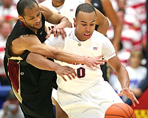 UA point guard Jerryd Bayless dribbles the ball past a defender during Arizonas 68-50 win over Concordia yesterday in McKale Center. The freshman scored eight points on 2-for-8 shooting while going 1-for-4 from beyond the arc. 