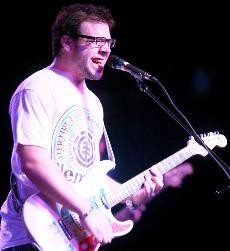 Pat Downes, lead singer and songwriter for Badfish, jams away during the Badfish concert last Thursday at the Rialto Theatre. After opening for themselves under the name Scotty Dont, Badfish revealed itself and closed out the show.
