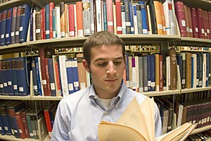 ASUA President Tommy Bruce peruses the German section of the Main Library. Bruce doesnt really know German, but it made a good photo op.