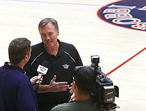 Phoenix Suns coach Mike DAntoni talks to reporters yesterday in McKale Center. The Suns will practice in McKale every day until Sunday, with the public scrimmage taking place Saturday night.