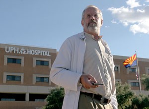 Barry Smith, an MRI technologist, stands outside while on break from working at the University Physicians Healthcare Hospital at the Kino Campus yesterday afternoon. The UA is working with the hospital to increase the number of new doctors in Arizona.