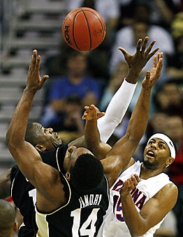 Arizona guard Mustafa Shakur has a rebound knocked away from him by Purdue forwards Carl Landry (14) and Gordon Watt (1) during the second half of Arizonas 72-63 first-round NCAA Tournament loss to the Boilermakers Friday in New Orleans. Shakur turned the ball eight times in that contest, capping a career that ended short of its initial hype.