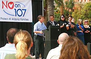 A crowd applauds former President Peter Likins after remarks made at the rally against Proposition 107 on the UA Mall yesterday. Likins said the rally was not to rile up current supporters, but to help swing voters understand why he and others are opposing the proposition, in hopes of winning their votes.  