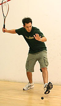 Arizona squash club member Mark Russell prepares to hit a squash ball Sunday night at the Student Recreation Center. The New Zealand native is part of the second-year club, which meets twice a week to practice squash, a sport that resembles racquetball.