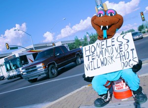 Journalism major Rodney Haas, undercover as his alter ego Sandy the Sidewinder, panhandles for cash and pity on the median of Speedway Boulevard and Park Avenue last Thursday. Sandy is the mascot for Tucsons Triple-A baseball team, who played their final game last Monday at Tucson Electric Park.  The team will move to Reno for the 2009 season.
