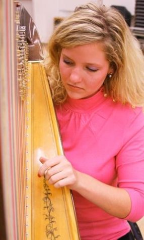 Fine arts senior Agnes Hall practices on her harp Oct. 13 with the HarpFusion group in preparation for their ""Takin' on the World"" concert on Oct. 18 at Crowder Hall at the UA School of Music.