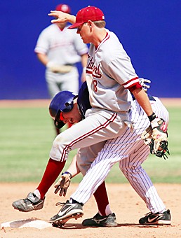 Arizonas Derek Decater tries to stay on second base while Stanfords Chris Lewis tries to tag him out during the eighth inning of Arizonas 12-3 win over Stanford, Sunday, April 23, 2006 at Kindall/Sancet Stadium. (Photo by Chris Coduto/Arizona DAily Wildcat)