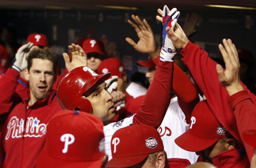 Philadelphia Phillies Raul Ibanez is greeted in the dugout after his home run in the seventh inning against the New York Yankees during Game 5 of the 2009 World Series at Citizens Bank Park, Monday, November 2, 2009, in Philadelphia, Pennsylvania. (Ron Cortes/Philadelphia Inquirer/MCT)