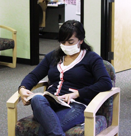 Lisa Beth Earle / Arizona Daily Wildcat

Gabi Ortiz, a psychology sophomore, wears a flu mask while waiting for her appointment at Campus Health on Tuesday, Nov. 3. Campus Health is encouraging both students and health professionals to wear protective masks to help prevent spreading the flu.