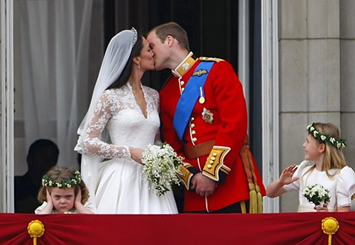 Prince William and  Kate Middleton share a kiss on a balcony at Buckingham Palace after  their wedding in London, England, on Friday, April 29, 2011. (Abaca Press/MCT)
