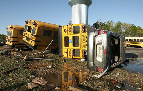 Several busses and cars were overturned at Page Middle School on Sunday, April 17, 2011 after a strong storm swept through Williamsburg, Virginia. (Rob Ostermaier/Newport News Daily Press/MCT)