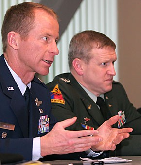 Air Force Lt. Col. Dave Stilwell speaks to a student as Army Col. Paul Wood listens during a panel hosted by the Association for Defense and Strategic Analysis club in the SUMC yesterday. The panel consisted of five senior officers from the Army War College who discussed recent and future military strategy.