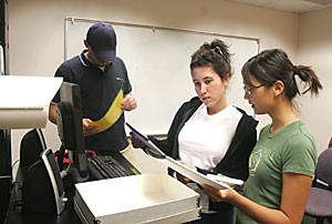 Accounting juniors Diana Lee (right) and Marra Longo (center), along with accounting senior Eric Lauritsen (left), work together in figuring out how to use the presentation technology in a meeting room in the Integrated Learning Center.