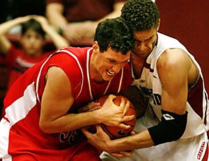 UA forward Ivan Radenovic, left, fights for the ball with Stanford forward Brook Lopez during the second half of Arizonas 85-80 overtime win Saturday at Stanford. Radenovic scored a career-high 37 points, grabbed nine rebounds and passed out seven assists without a turnover.