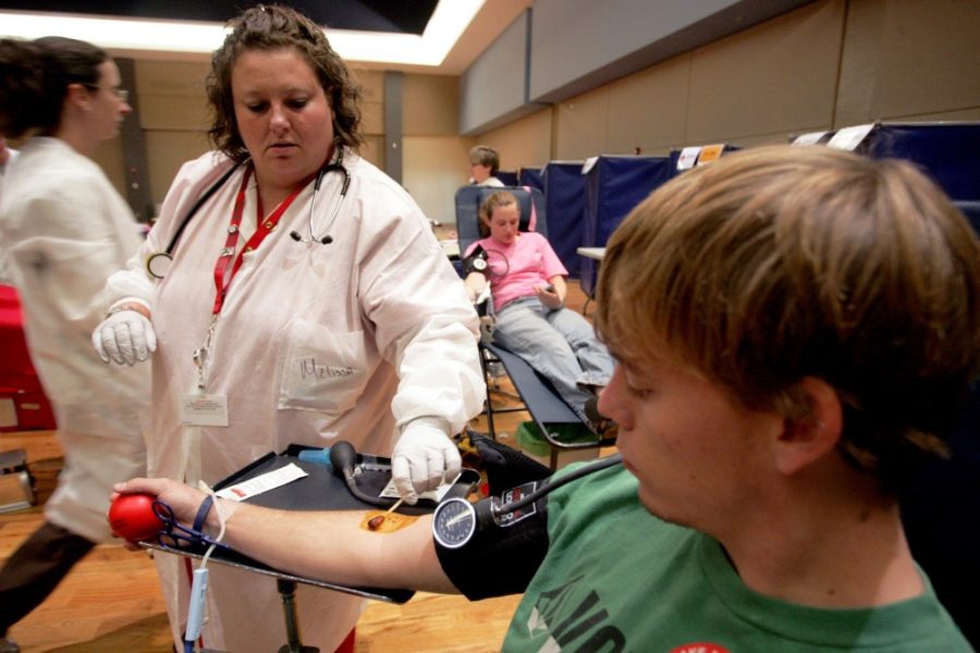 In this September 2009 file photo, Donor Service Technician Melissa Mutz, left, applies iodine to Andrew Devore?s arm before he donates blood in the SUMC.