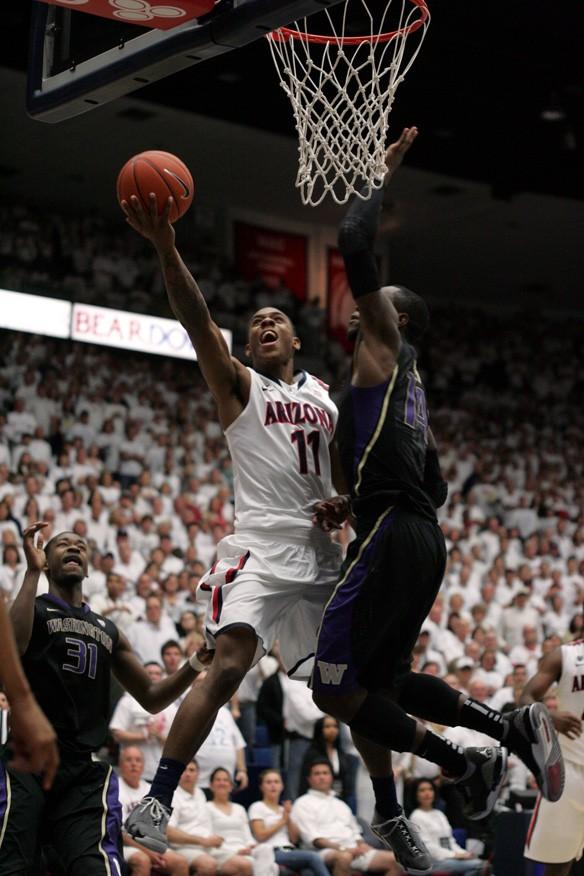 Arizona freshman guard Josiah Turner attempts the game-tying put-back attempt in the closing seconds of the Wildcats 69-67 loss to the Washington Huskies on Saturday, January 28, 2012, in McKale Center at the University of Arizona. 

Colin Darland / Daily Wildcat