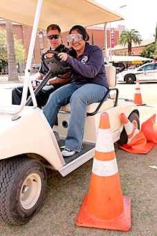 Jake Lacey/ Arizona Daily Wildcat

TPD brought out lots of stuff to promote safety before spring break. Students drove golf carts through a course with beer goggles on. 