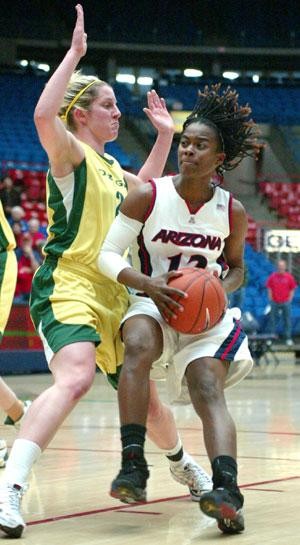 UA guard Ashley Whisonant drives to the hole in last nights 65-60 win over Oregon in McKale Center. The Wildcats have now won two Pacific 10 Conference games.