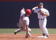 Arizona second baseman Mike Weldon turns a double play as Georgia infielder Colby May slides into second base during a 10-5 Bulldog win on Sunday at Sancet Stadium. The Wildcats play Holy Cross tonight at 7.