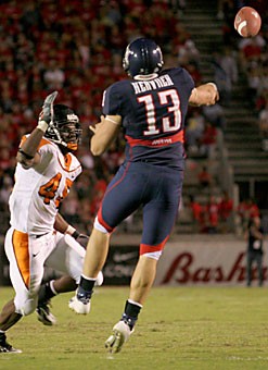Senior quarterback Kris Heavner gets off the ground as he releases a throw in Arizonas 17-10 loss to Oregon State on 