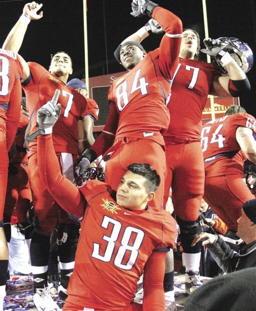 Members of the 2008 Arizona Wildcats football team celebrate after their victory at the Pioneer Las Vegas Bowl on Dec. 20, 2008. Although it was an achievement for Arizona to make it to the Las Vegas Bowl last season, an appearance in Sin City again in 2009 would be a disappointing end for the Wildcats this season. 