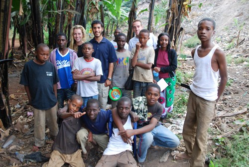 Jenna Sussex,left, Danny Low, and Adam Rubin pose with a group of street kids on the edge of a Tanzanian jungle. The club they are in, Support for International Change, helps support education about HIV and AIDS in northern Tanzania.