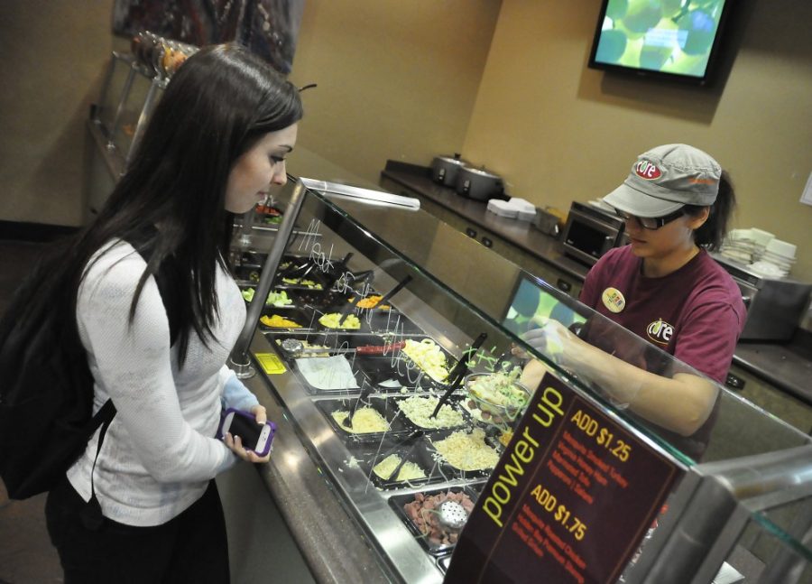 Alex Kulpinski / Arizona Daily Wildcat

Pre-Physiology Freshman Lauren Hasstedt orders a salad for lunch, prepared by English Freshman Deb Garcia, at Core on Friday afternoon. Core lets you construct your salad just the way you like it.



