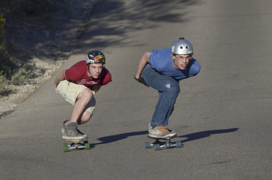 Colin Prenger / Daily Wildcat

Raymond Robinson (left), co-founder of AZ Push longboarding club, holds his tuck behind another contestant during a downhill heat last Saturday. AZ Push is a longboarding club for those who seek high speed boarding, or those who simply want to improve their skills. 