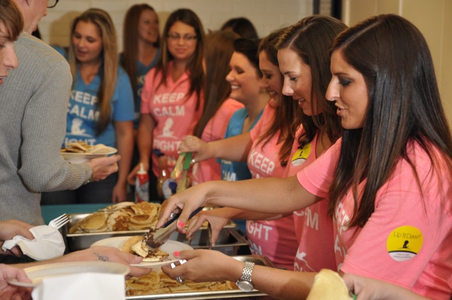 Alex Kulpinski / Arizona Daily Wildcat

Delta Delta Delta sorority members serve all you can eat pancakes at their annual D-Hop event.  The unlimited flap-jacks are part of the sororities philanthropy.  
