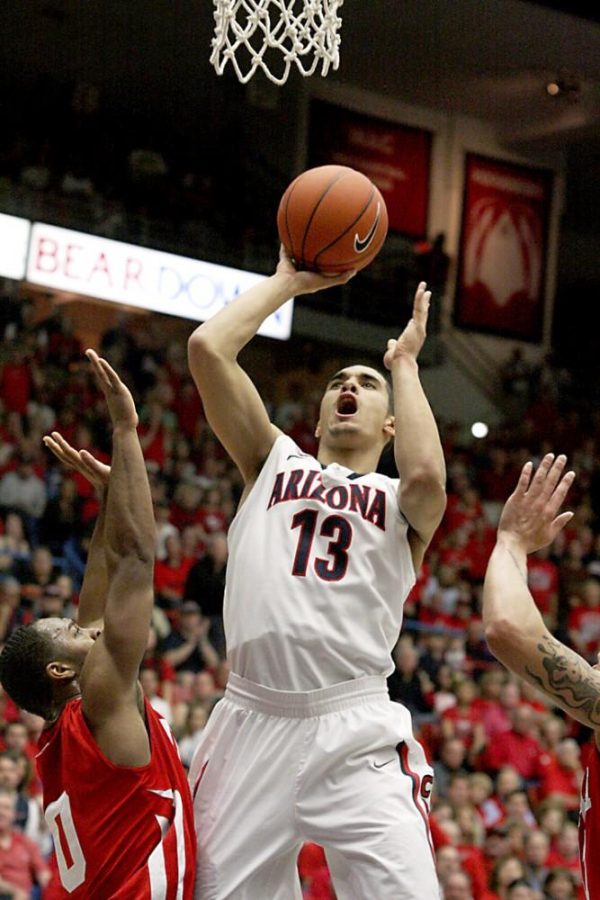Colin Darland / Daily Wildcat

Arizona freshman guard Nick Johson, 13, puts up a well-defended jumper during the second half of the Wildcats match-up against the Utah Utes in McKale Center on Saturday, February 11, 2012
