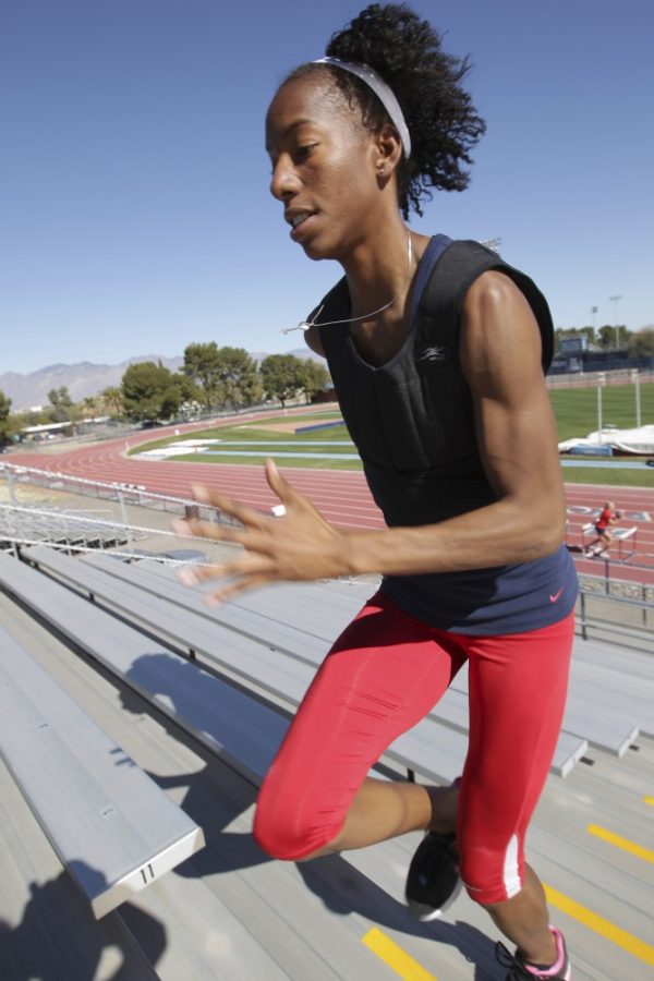 Gordon Bates / Arizona Daily Wildcat
Bridgetta Barrett, UA high jump junior, does strength training at Drachman Stadium this Monday Jan 30.