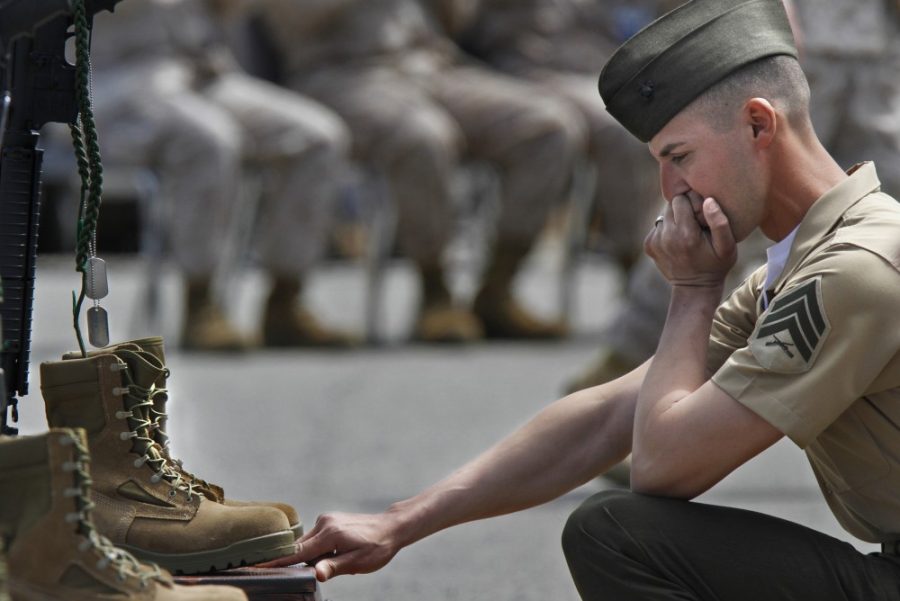 Sgt.+John+Kladitis+kneels+before+the+memorial+to+Sgt.+William+Stacey+during+a+ceremony+at+Camp+Pendleton%2C+California%2C+on+Thursday%2C+April+12%2C+2012%2C+to+honor+five+U.S.+Marines+recently+killed+in+Afghanistan.+Stacey+was+killed+by+a+roadside+bomb+while+on+his+fifth+tour+of+duty.+%28Don+Bartletti%2FLos+Angeles+Times%2FMCT%29%0A%0A