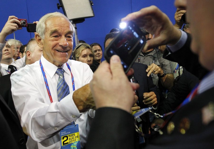 A delegate tries to squeeze off a picture as Texas congressman Ron Paul signs an autograph for him at the Republican National Convention at the Tampa Bay Times Forum in Tampa, Florida, Tuesday, August 28, 2012. (Tom Fox/Dallas Morning News/MCT) 