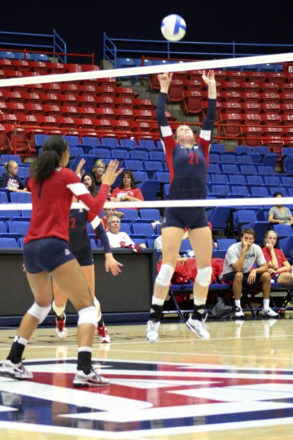 Kyle Wasson/Arizona Daily Wildcat

Lauren Fuller, No. 21, and the UA womens volleyball team play early last week at home. 
