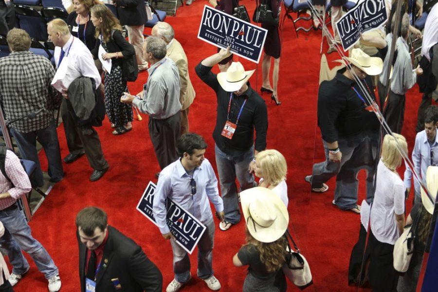 Alternate Colorado delegate and Ron Paul supporter Alex Casetta, center, holds a Ron Paul sign on the floor of the Tampa Bay Times Forum in Tampa, Florida, Monday, August 27, 2012. (Edmund D. Fountain/Tampa Bay Times/MCT)

******BRADENTON OUT******