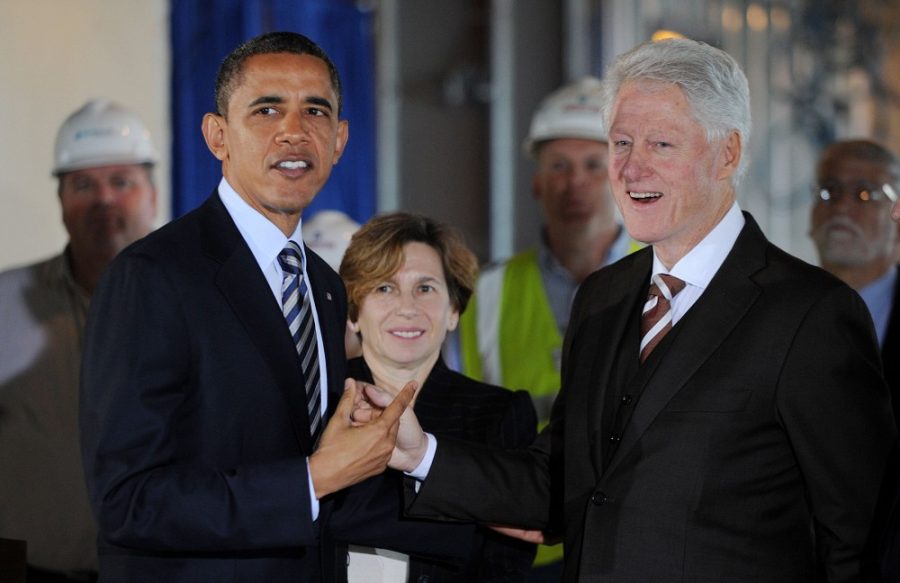 President Barack Obama and Former President Bill Clinton tour a 