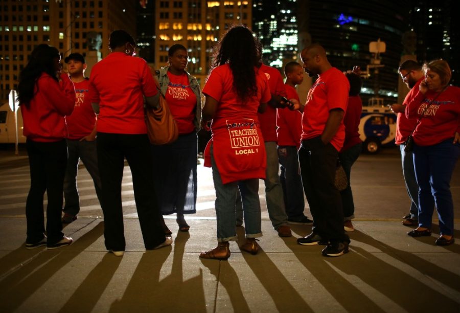 Chicago Teachers Union members gather outside the Merchandise Mart, Sunday, September 9, 2012, in Chicago, Illinois. Chicagos teachers union said it will strike Monday for the first time in 25 years after talks with Chicago Public Schools ended late Sunday night without resolution. (E. Jason Wambsgans/Chicago Tribune/MCT)