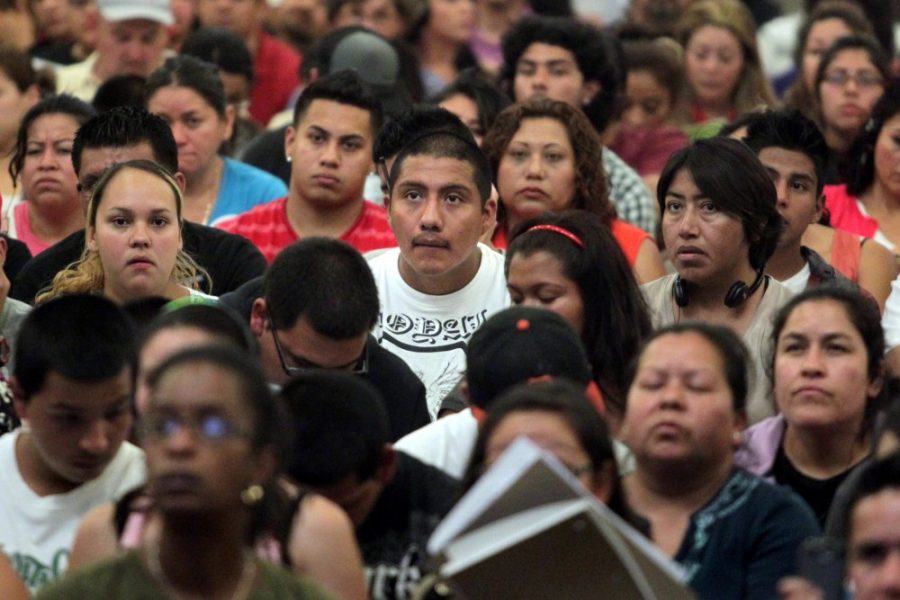 Bay Area's young immigrants and families listen to attorney Mark Silverman as he guides them to fill in their Deferred Action for Childhood Arrivals forms at Cesar Chavez Learning Center in Oakland, California, on Thursday, August 23, 2012. (Ray Chavez/Oakland Tribune/MCT)
