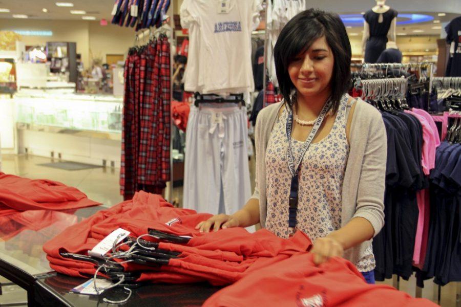 Noelle R. Haro-Gomez/ Arizona Daily Wildcat

Miriam Sigala, 18, works in the clothing department in the UA Bookstore.