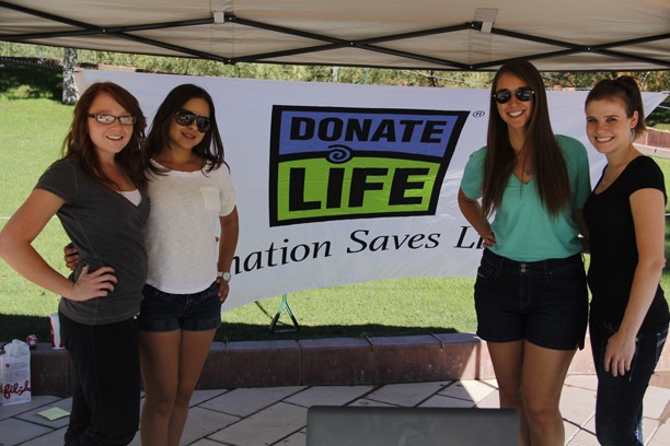 Noelle R. Haro-Gomez/ Arizona Daily Wildcat

From the left, Sarah Naves, Mariana Valencia, Jayme Gosney and Kelsey Hill, vollunteers for UA Students for Organ Donation, to register new donors. The booth will be out all week infront of the administration building by the UA mall.