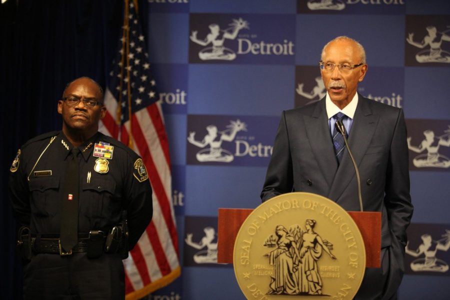 Interim police chief Chester Logan, left, stands with Detroit Mayor Dave Bing as he addresses the media about controversy surrounding police chief Ralph Godbee Jr., Monday, October 8, 2012 from his office in the Coleman A. Young Municipal Center in Detroit, Michigan. (Mandi Wright/Detroit Free Press/MCT)
