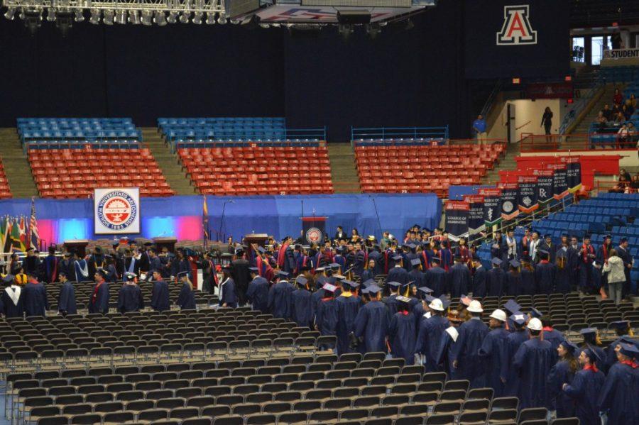 	Ryan Revock / Arizona Daily Wildcat

	Undergraduate, graduate and doctoral students file into McKale Center Saturday for the 2012 winter commencement.